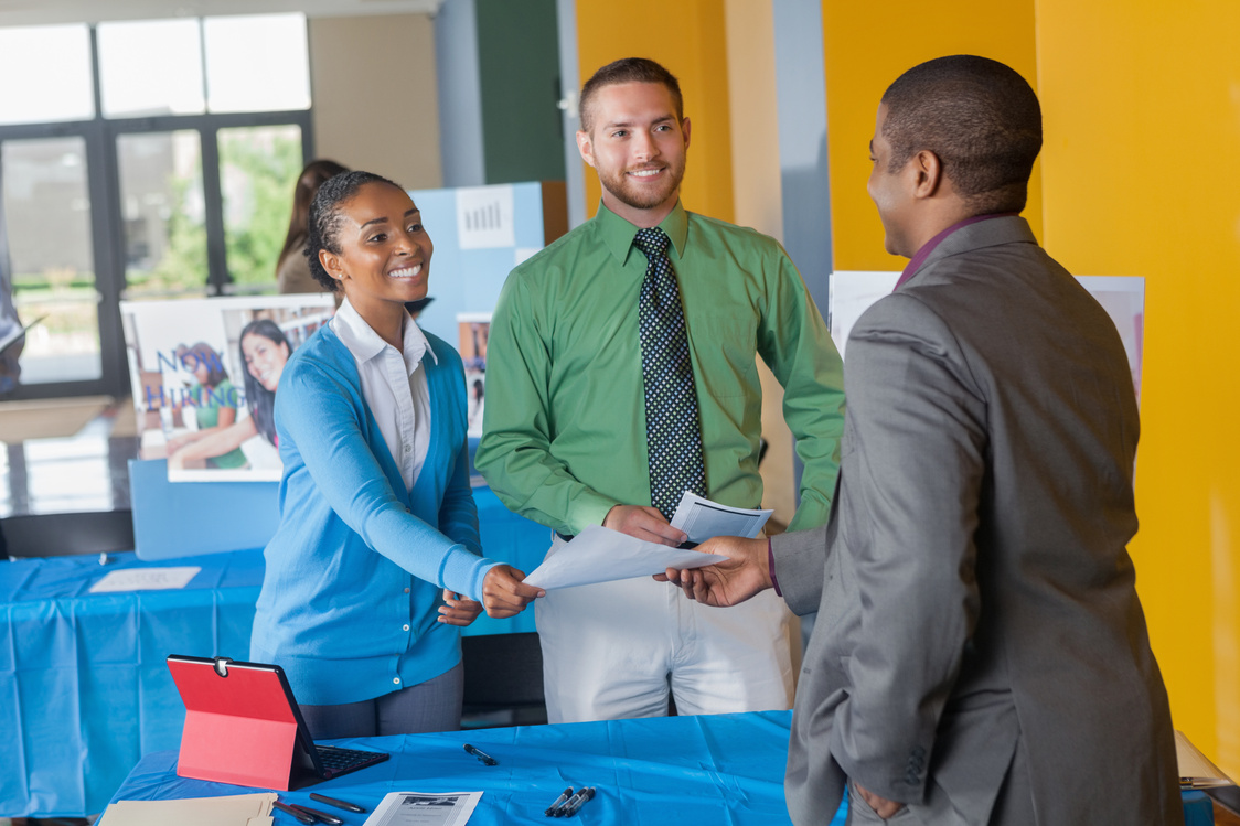 Professional businessman seeking employment at job fair event