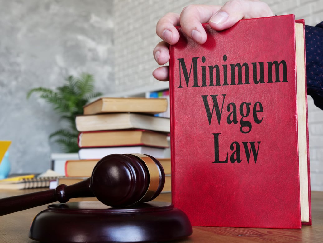 Minimum wage law is shown on the conceptual business photo